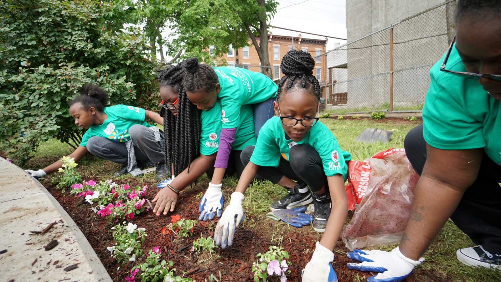 Comcast Cares Day volunteers gardening