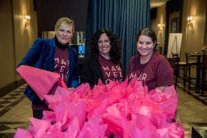 women handing out gift bags