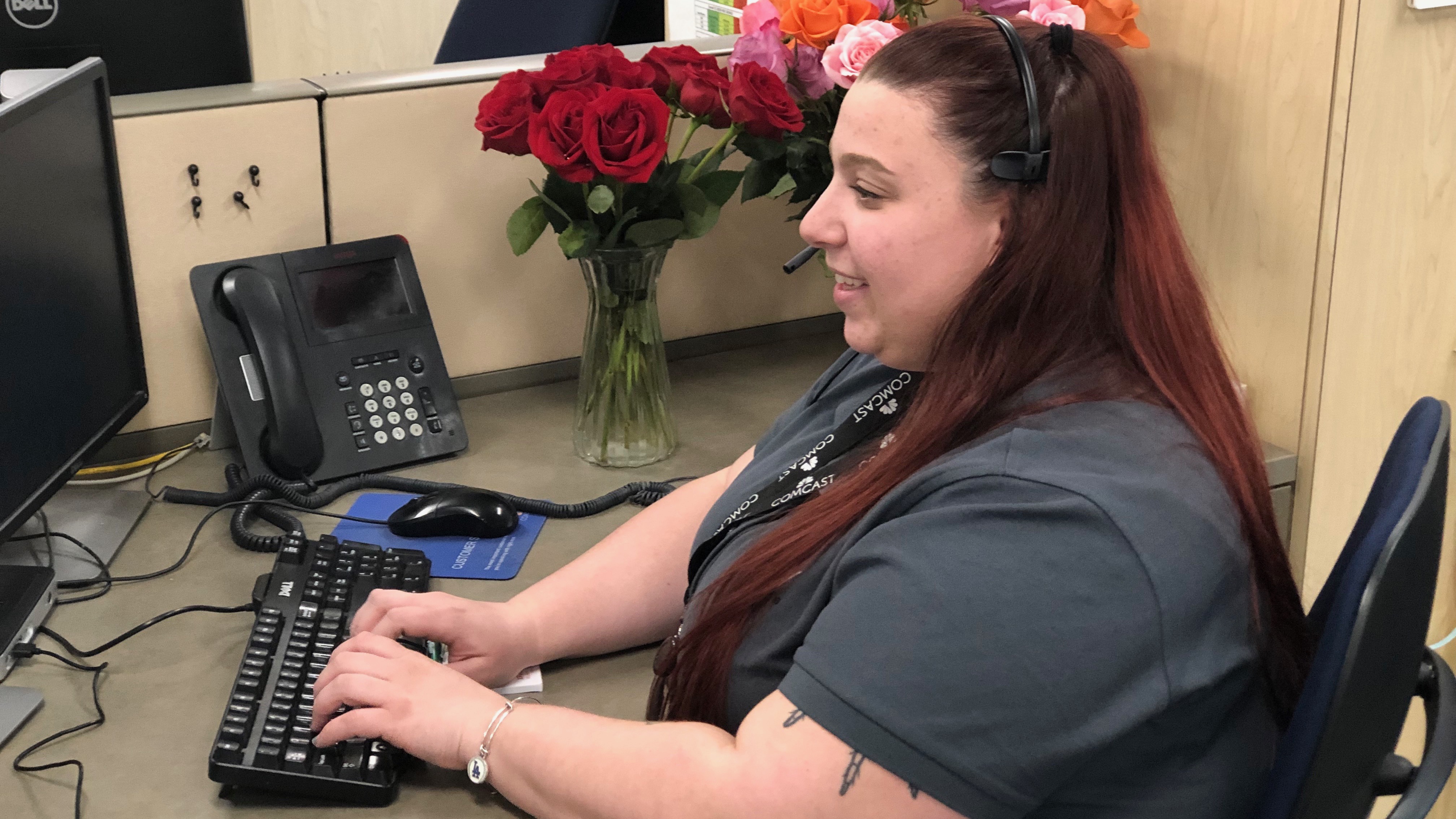 woman at desk typing