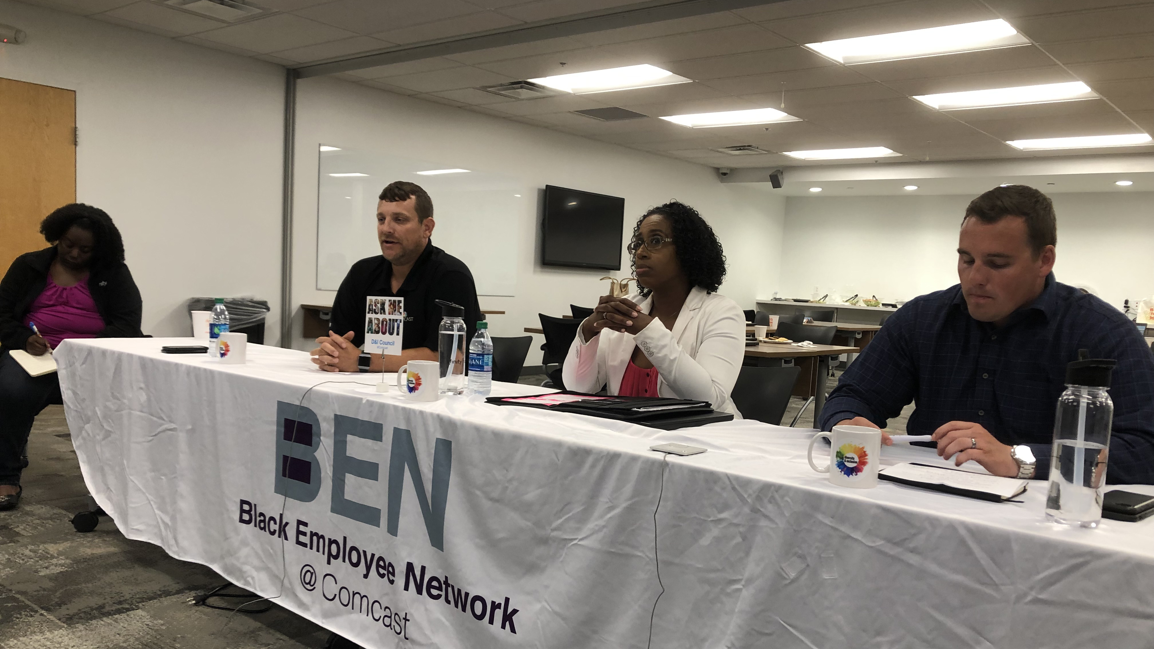 Members of the Black Employee Network sit together at a table.