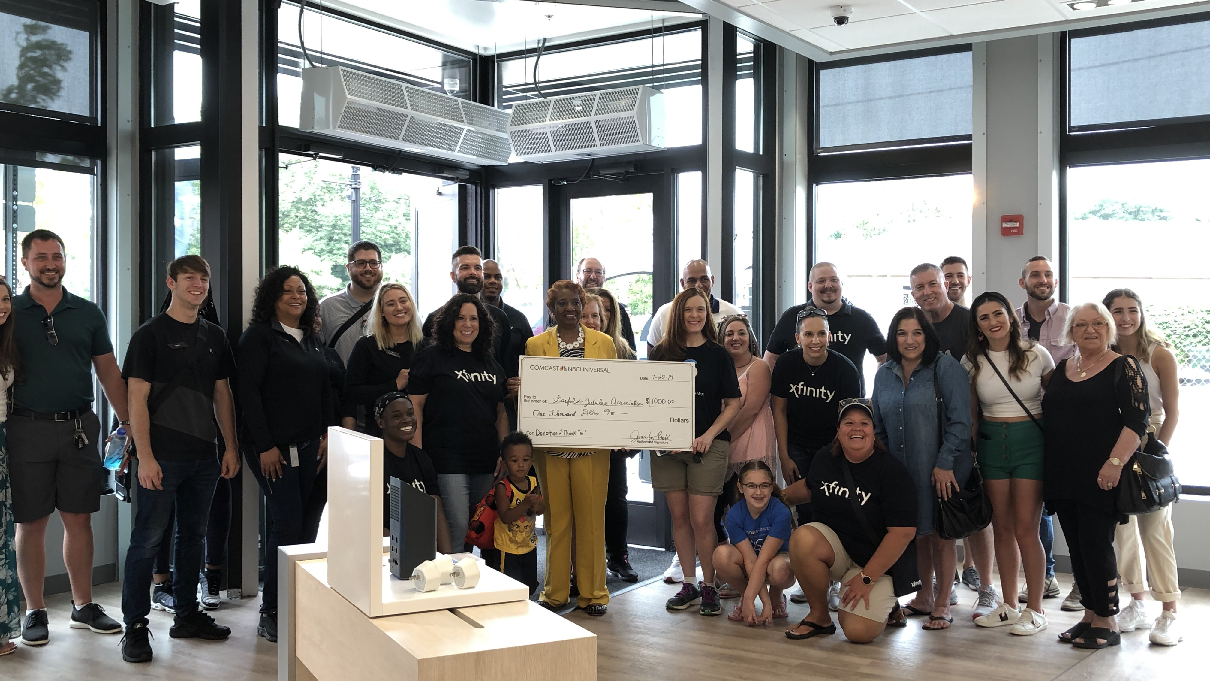 Members of Pittsburgh’s East Liberty neighborhood at an event in an Xfinity Store.