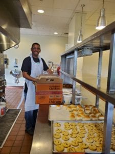 employee putting food out on trays