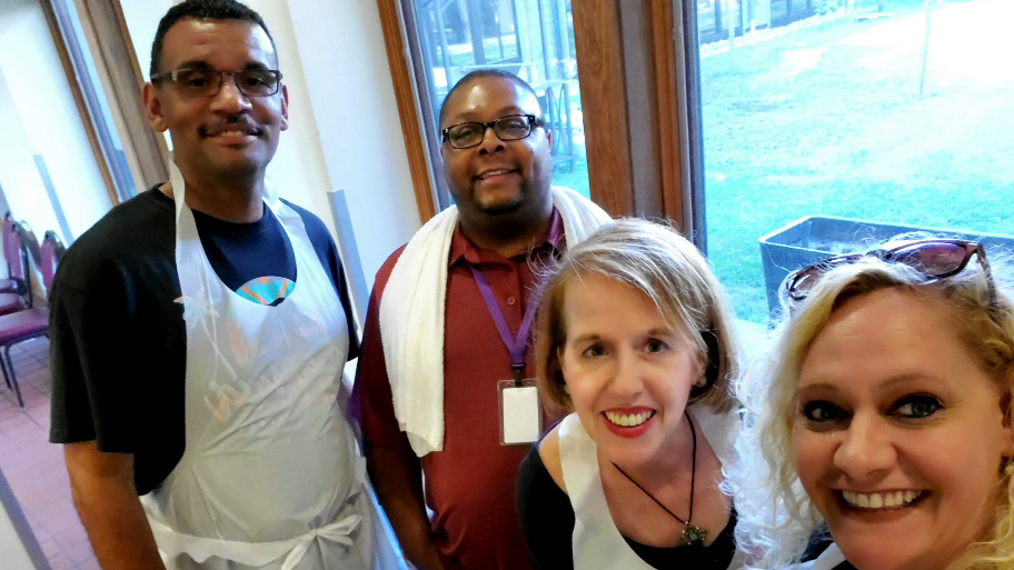 Members of the Unidos employee resource group work in a kitchen.