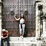 Dana Brooks standing in front of ancient door