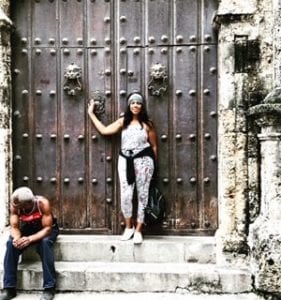 Dana Brooks standing in front of ancient door