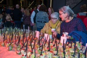 Two women looking at desserts at Blast party