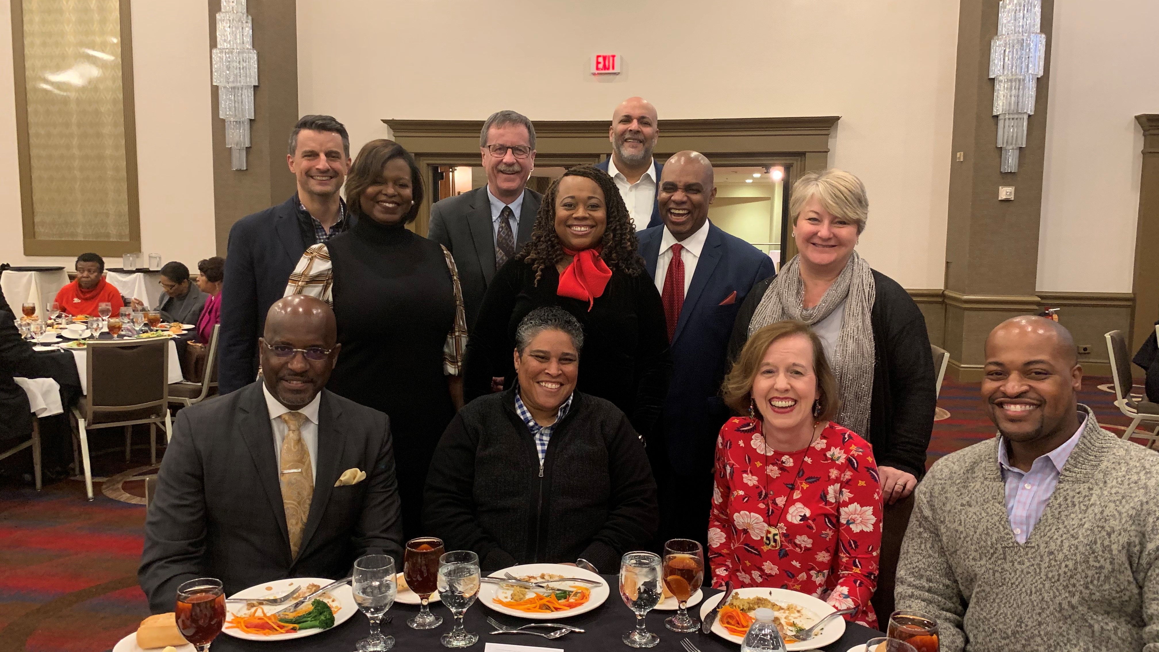 employees smiling at a lunch event