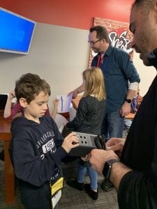 Child installing internet in BizTown's Sheetz