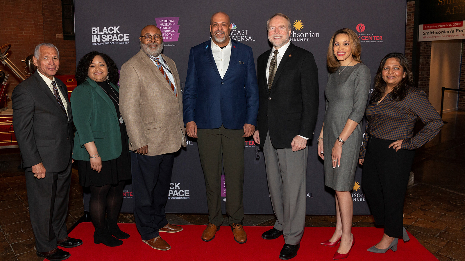 Senior leaders from Comcast on the red carpet at a private movie screening.