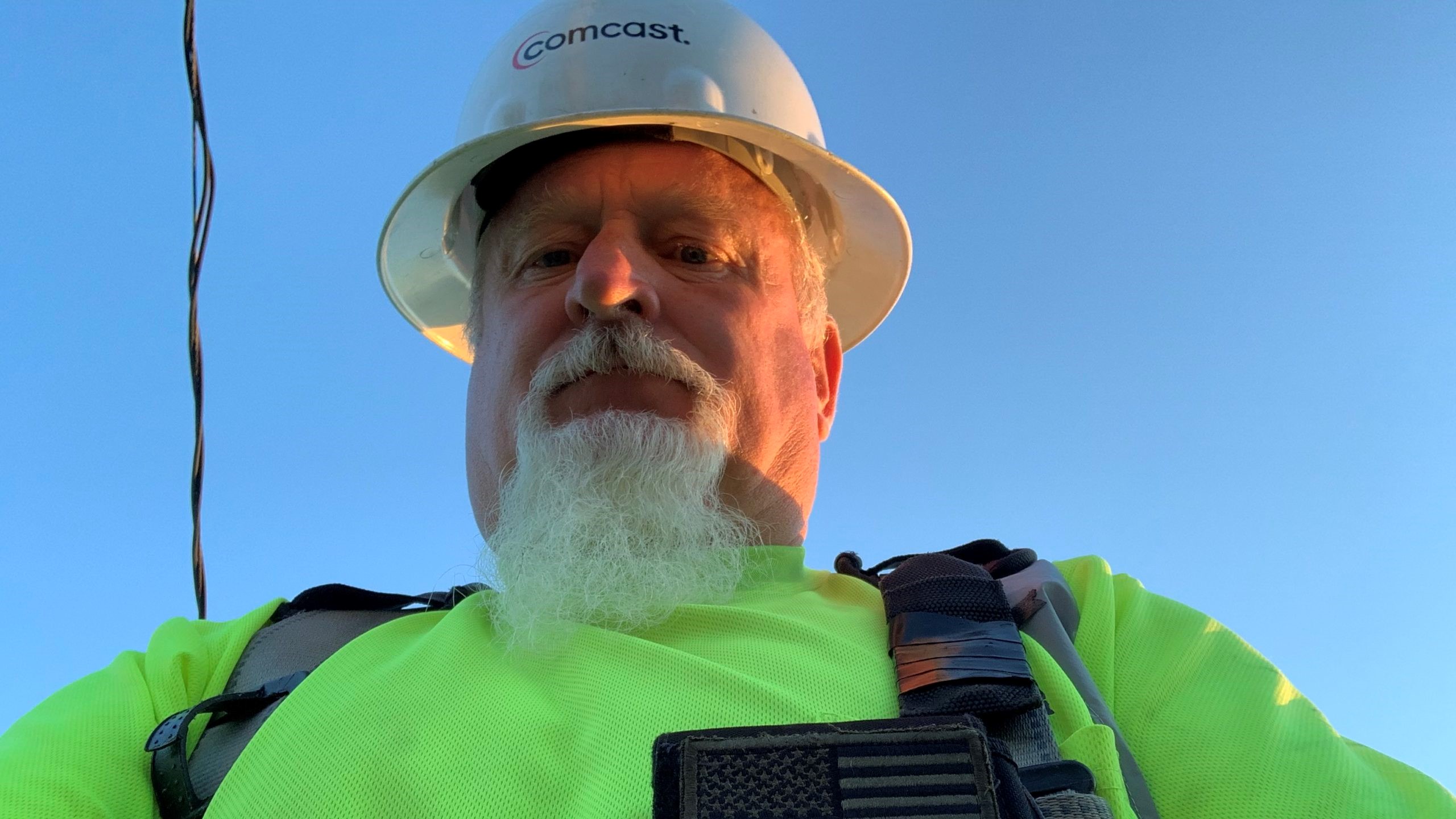 Comcast employee wearing hardhat