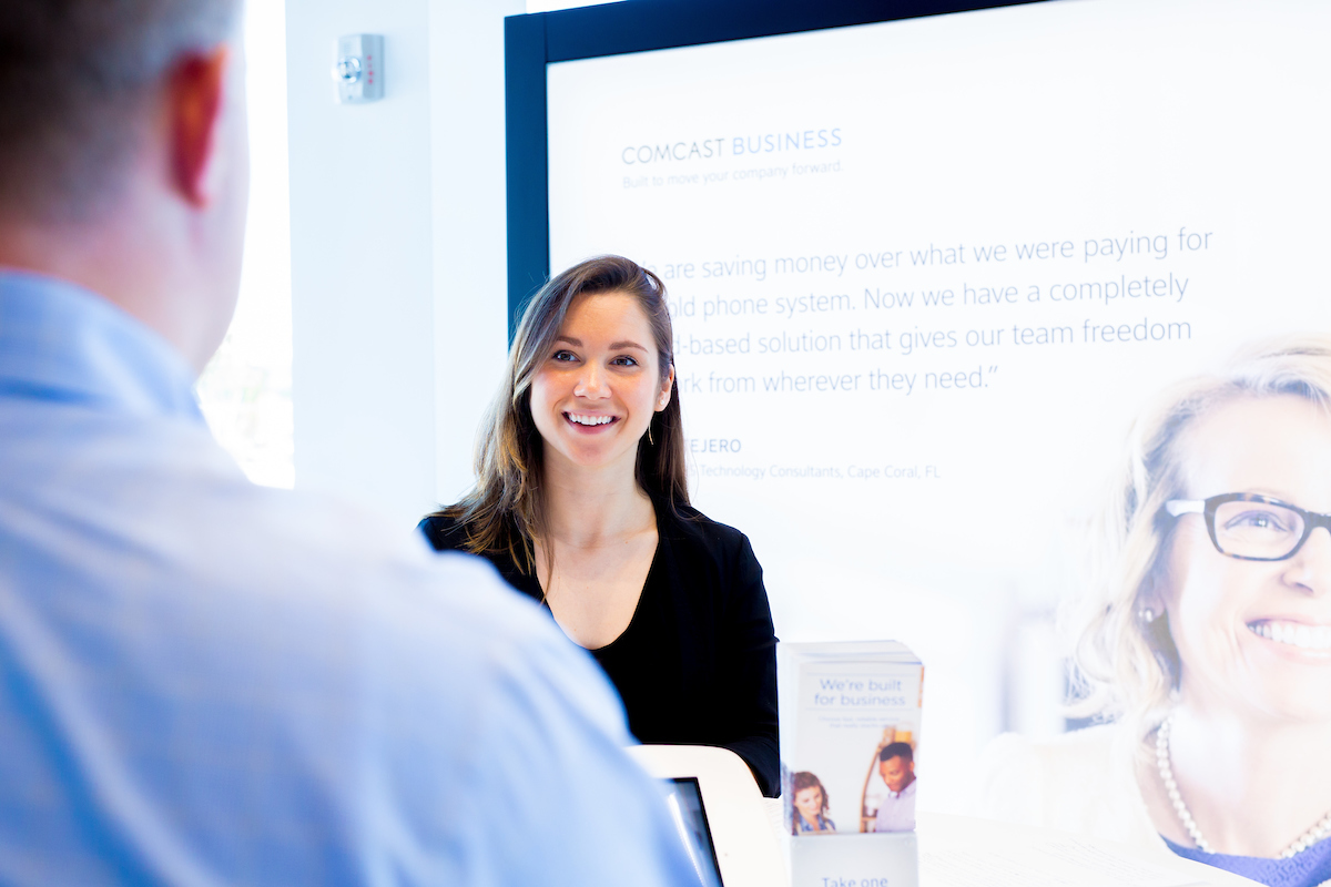 Woman speaking to Comcast Business employee