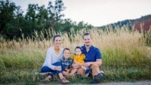 Radicic Family sitting in field