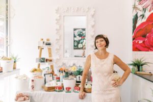 Woman standing inside Una Biologicals store