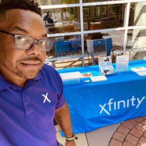 Lance next to Xfinity table