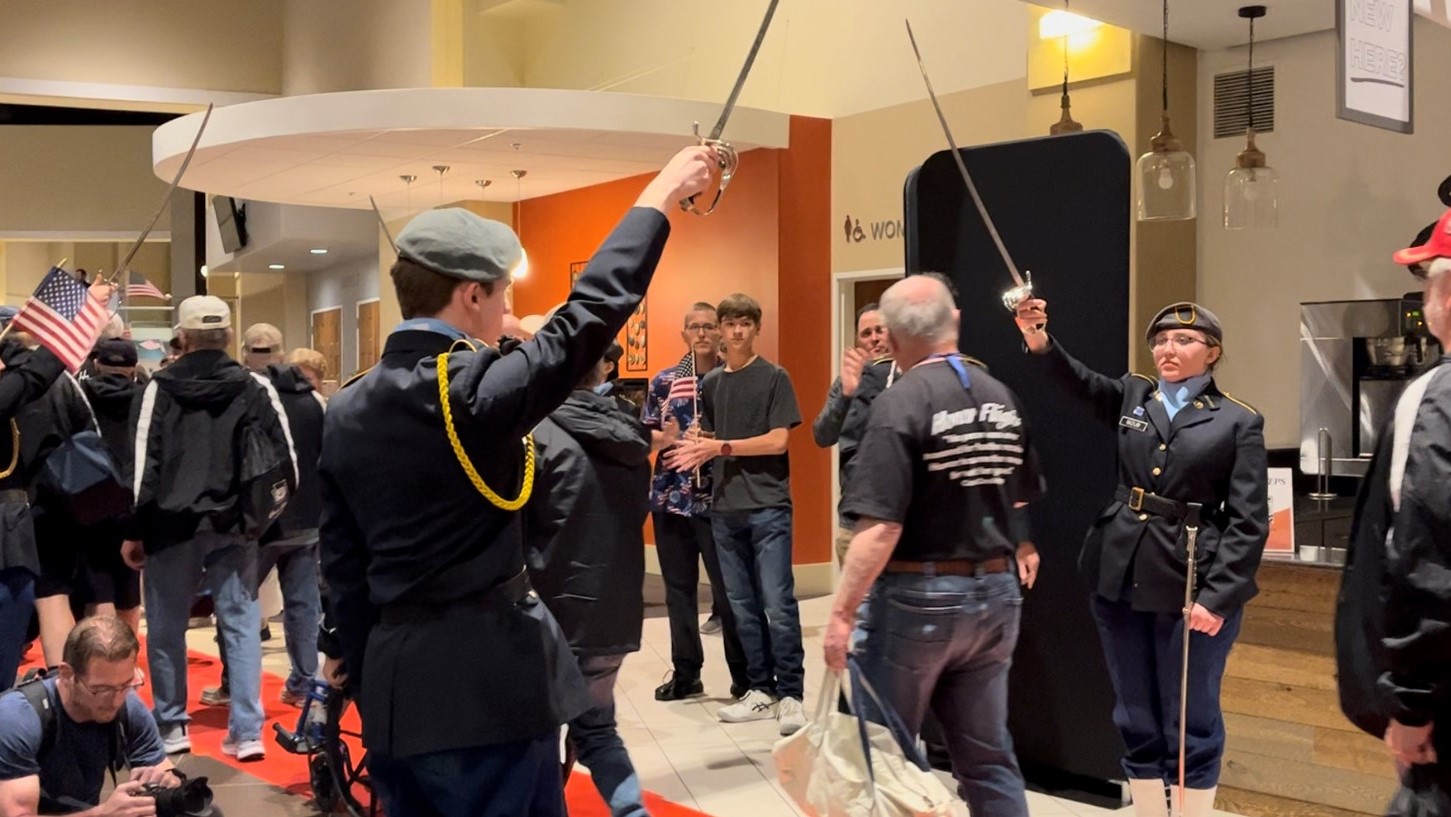 Military honor guard welcoming home veterans