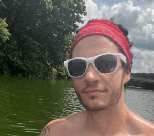 Man wearing sunglasses near river